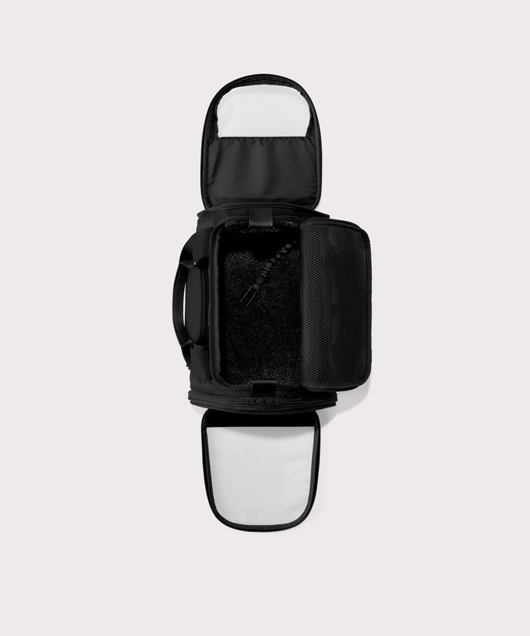 Dagne Dover small Kyoto Pet Carrier in black seen unzipped, top down view.

