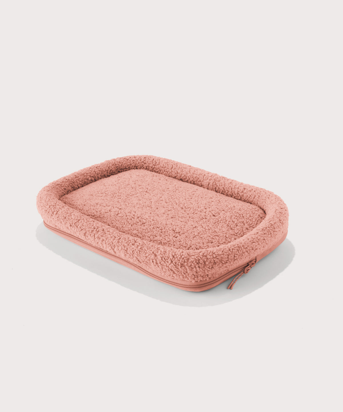 Dagne Dover small Kyoto Pet Carrier removable padded faux sherpa pet bed in a warm dust pink.
