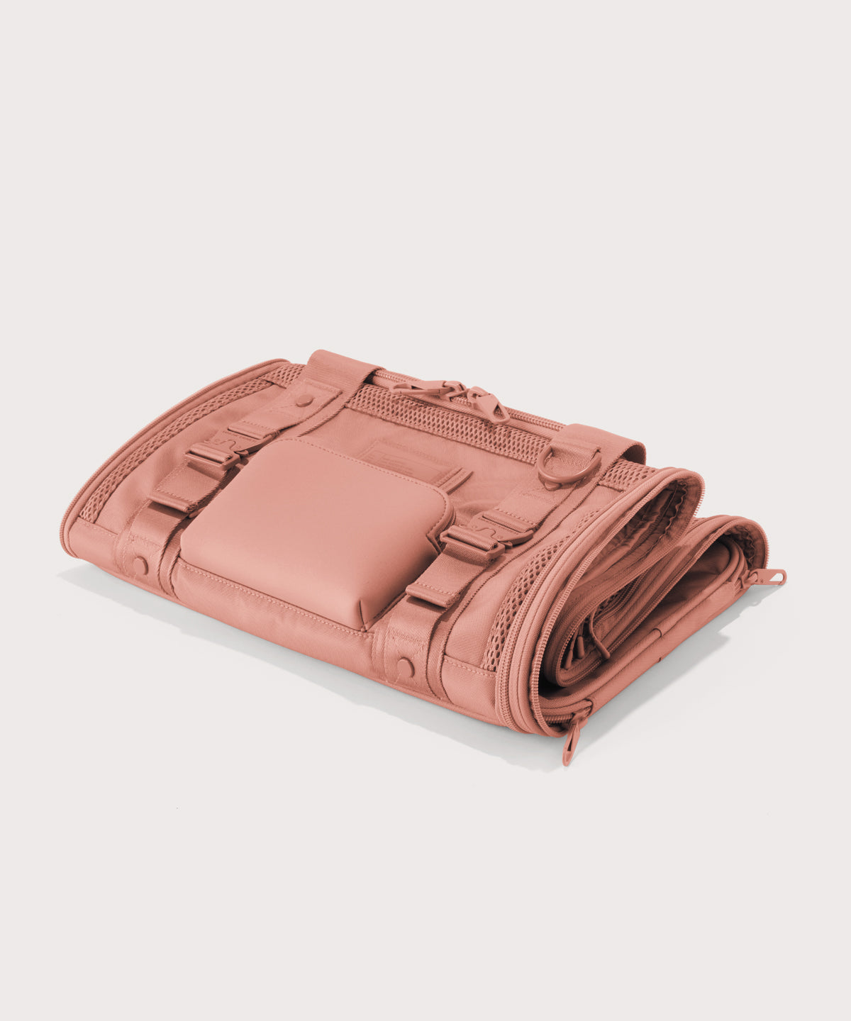 Dagne Dover small Kyoto Pet Carrier in a warm dust pink folded flat.
