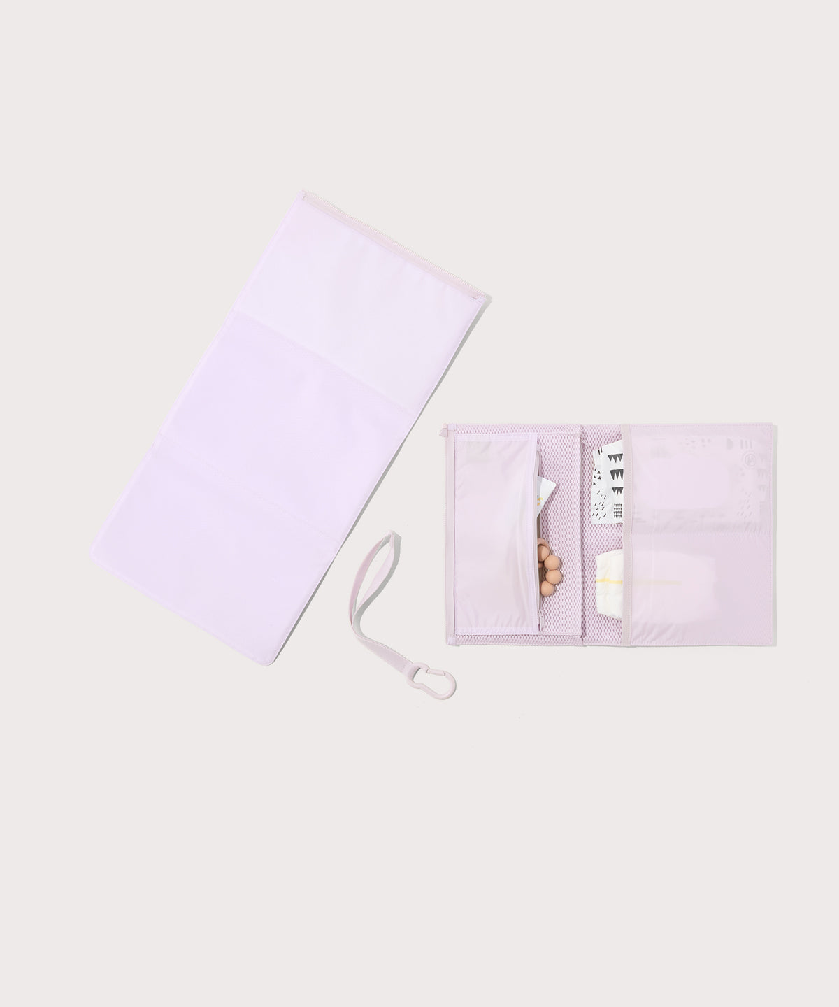 Dagne Dover Joey Changing Kit in  a soft purple with grey undertones unfolded, revealing the detachable changing mat.
