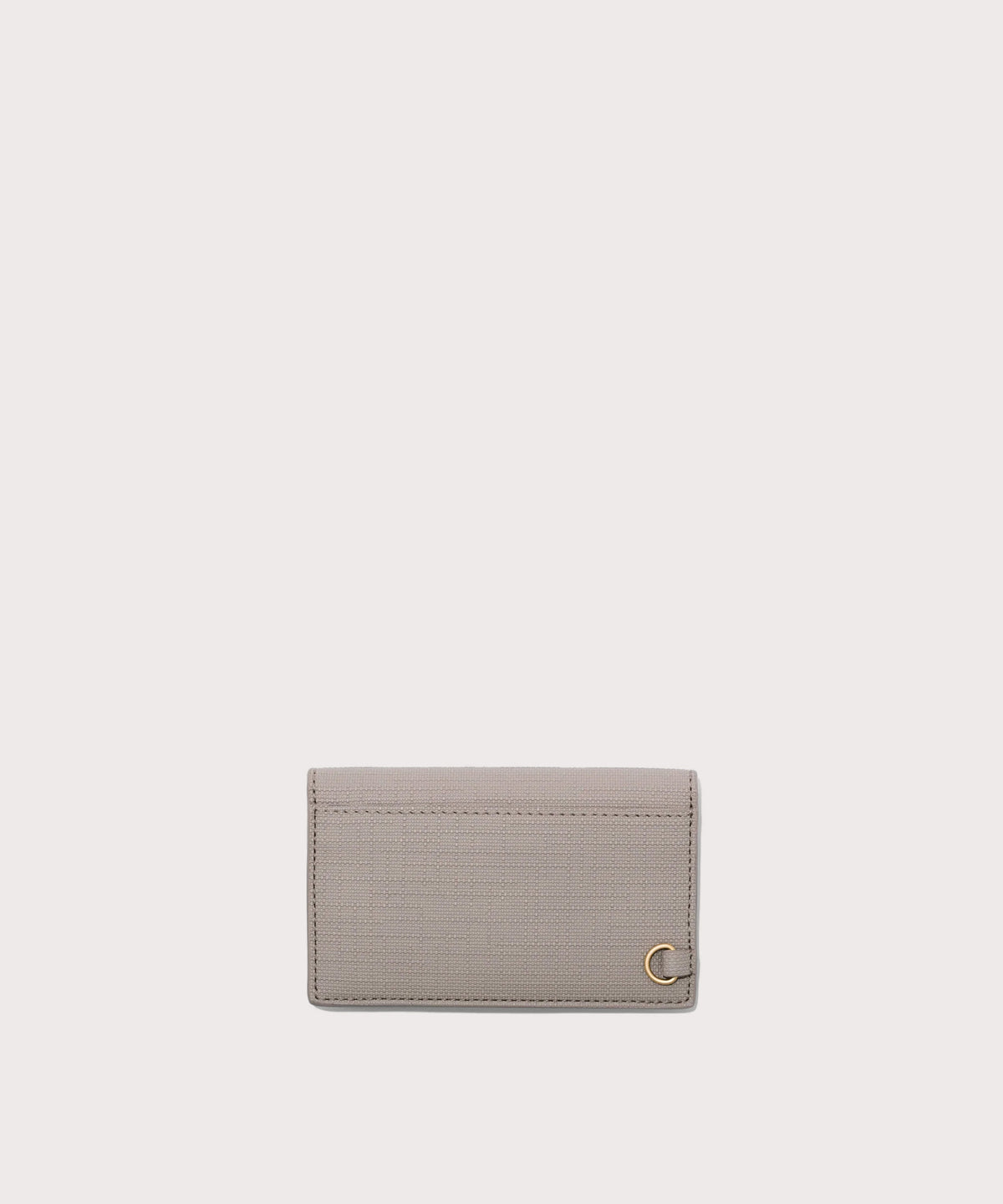Dagne Dover vegan Card Case in light grey seen from the back revealing the one external card slot.
