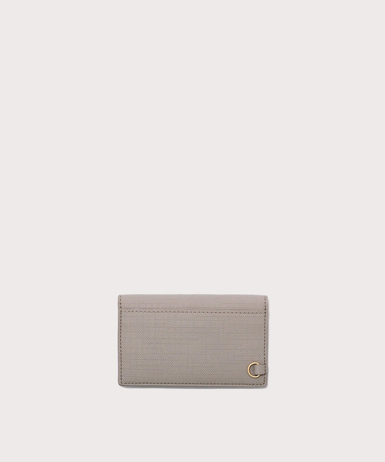 Dagne Dover vegan Card Case in light grey seen from the back revealing the one external card slot.
