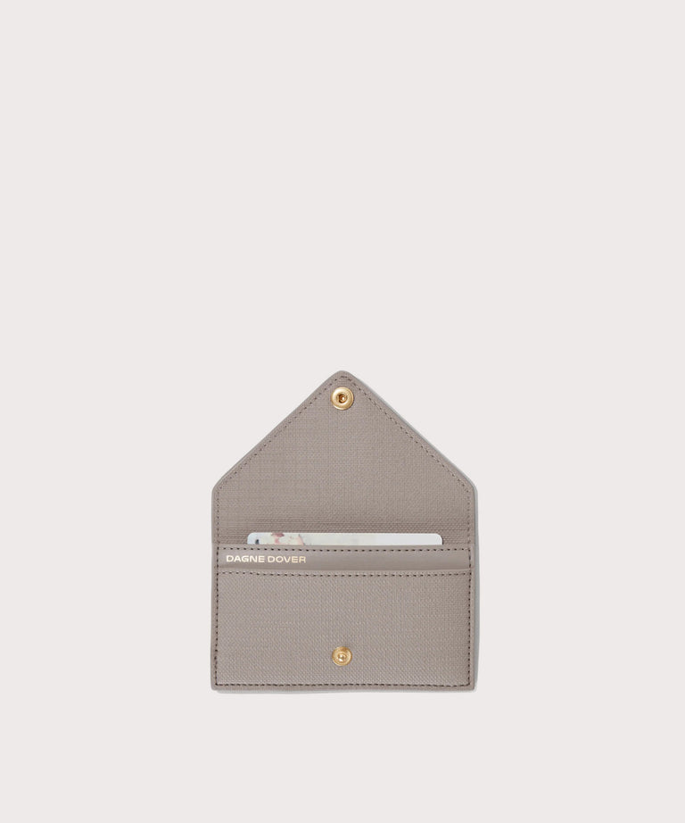 hover - Dagne Dover vegan Card Case in light grey opened revealing the two internal card slots.