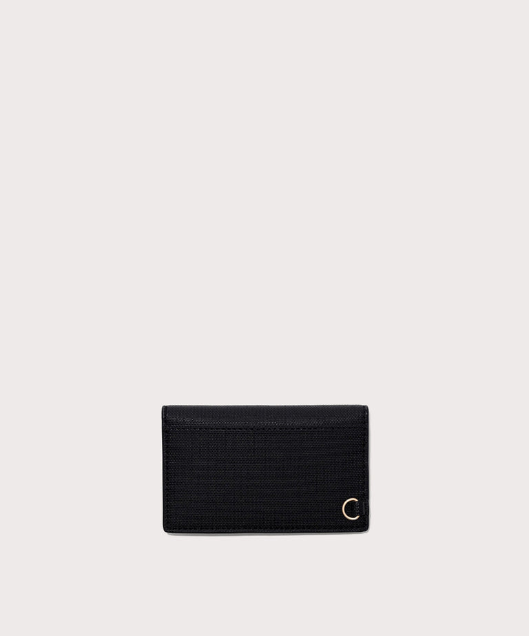 Dagne Dover vegan Card Case in black seen from the back revealing the one external card slot.
