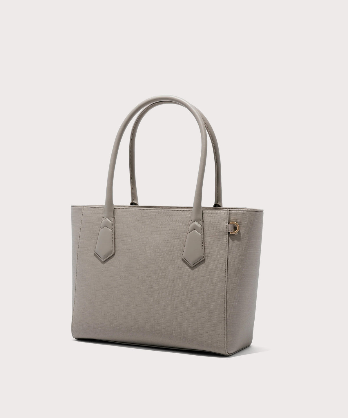 Dagne Dover classic Signature Leather Tote in beige seen from an angle.
