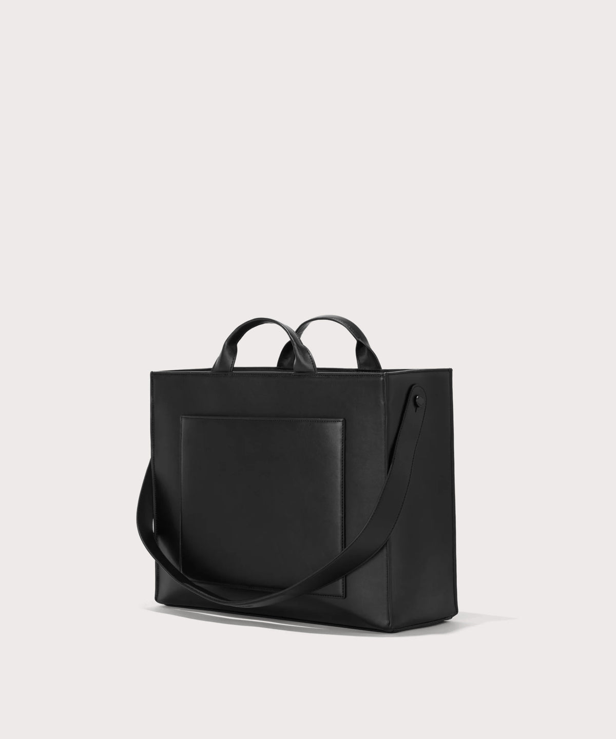 Dagne Dover medium vegan Daily Tote in black seen from an angle.
