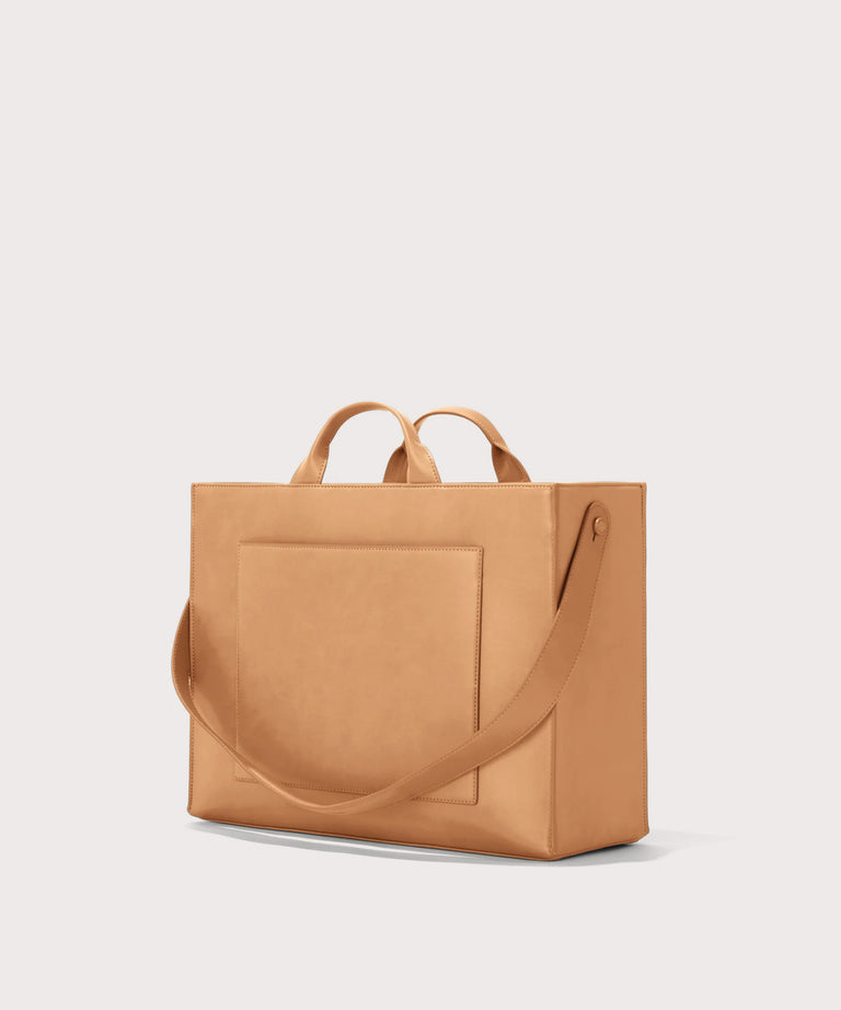 Dagne Dover large vegan Daily Tote in brown seen from an angle.
