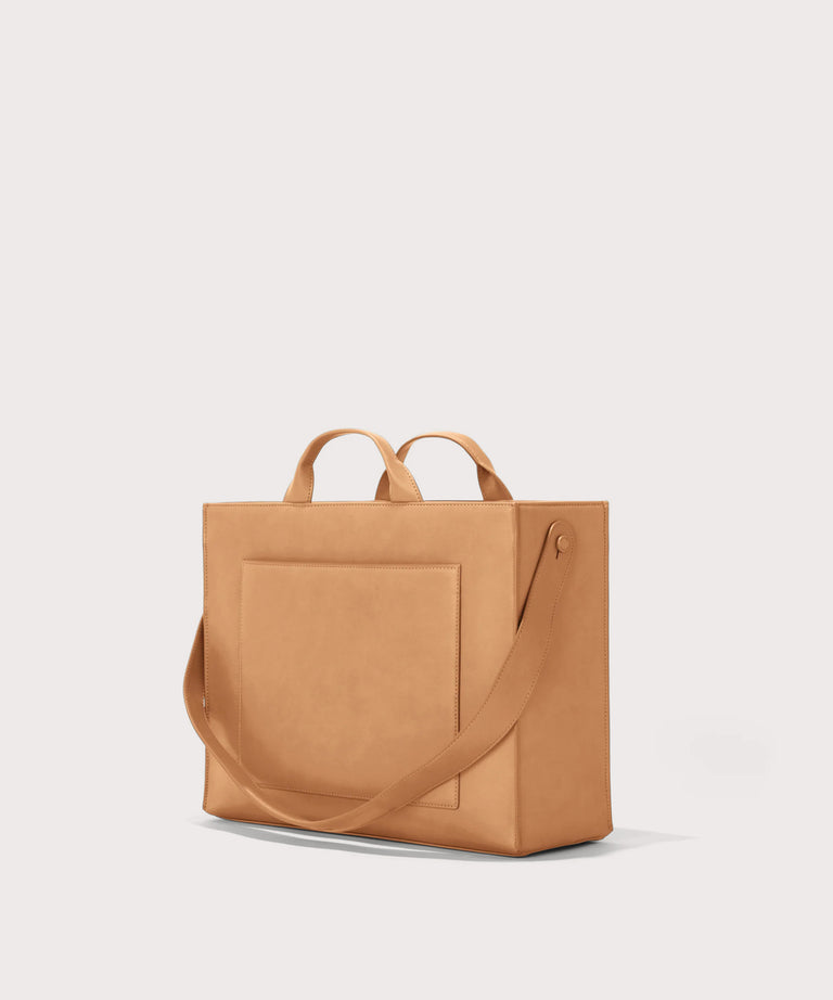 Dagne Dover medium vegan Daily Tote in brown seen from an angle.
