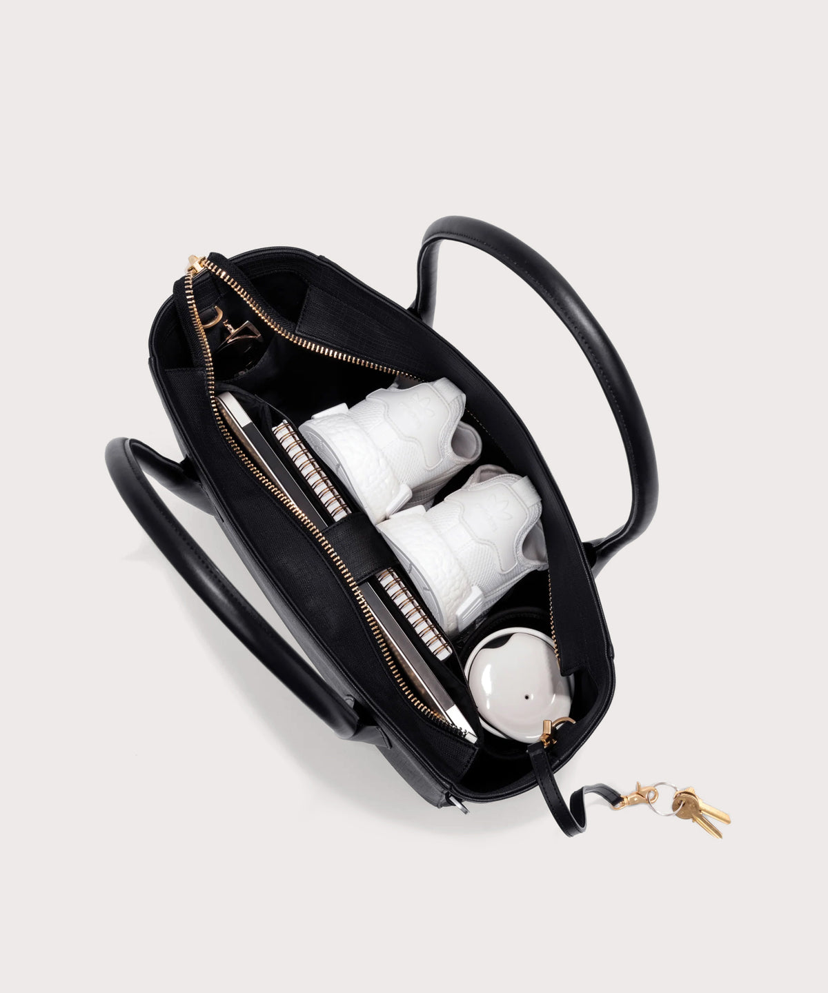 Dagne Dover Legend Signature Leather Tote in black seen from above, revealing 2 slip pockets, the neoprene bottle holder, and large interior zipper pocket.