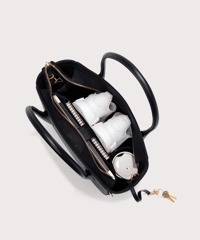 Dagne Dover Legend Signature Leather Tote in black seen from above, revealing 2 slip pockets, the neoprene bottle holder, and large interior zipper pocket.