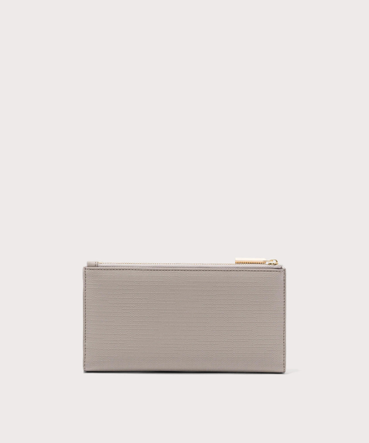 Dagne Dover Slim Wallet in beige seen from the back.
