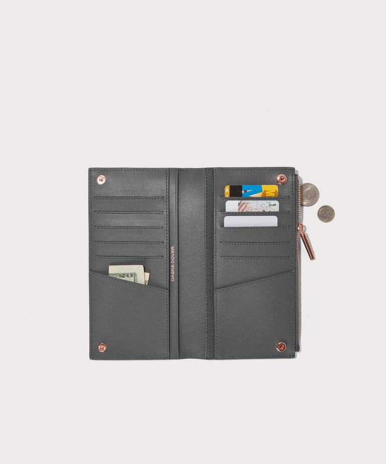 Dagne Dover Slim Wallet in grey unclasped, revealing ten card slots, two additional slip pockets, and four cash pockets.