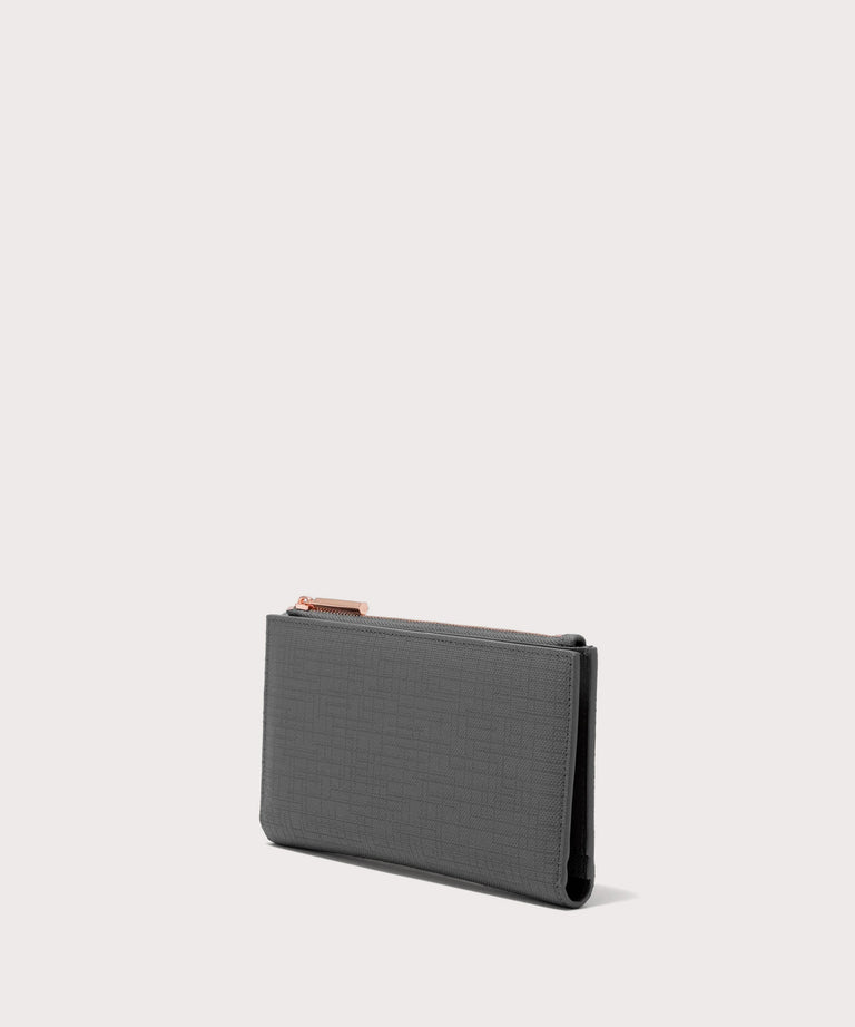 Dagne Dover Slim Wallet in grey seen from an angle.
