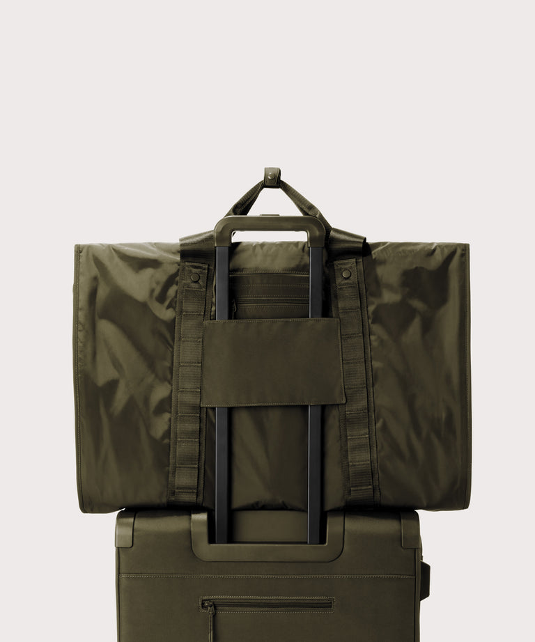 Back view of Capri garment bag in dark moss on luggage handle