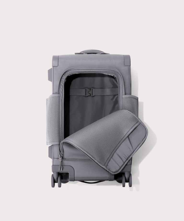 Top down of Seattle carry-on rolling luggage 23.5” in light grey with front flap opened. 
