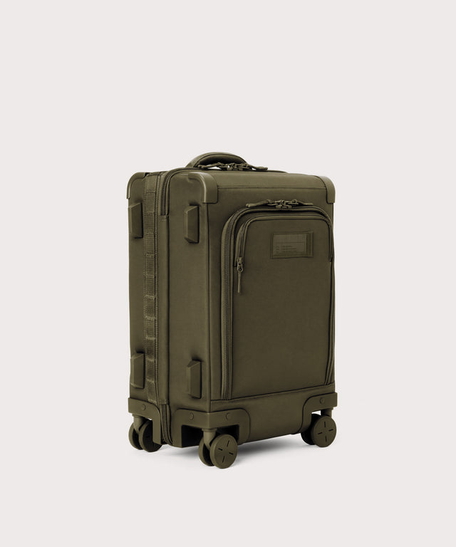 3/4 front view of Seattle carry-on rolling luggage 20.5” in dark green showing side luggage feet
