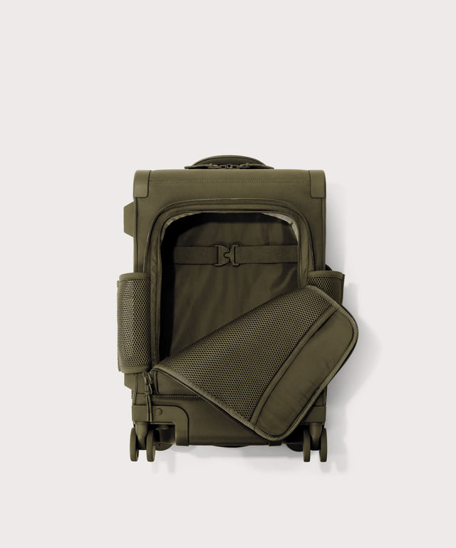 Top down of Seattle carry-on rolling luggage 20.5” in dark green with front flap opened. 
