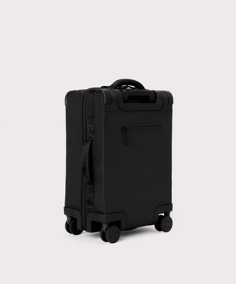 3/4 front view of Seattle carry-on rolling luggage 20.5” in onyx showing side luggage feet
