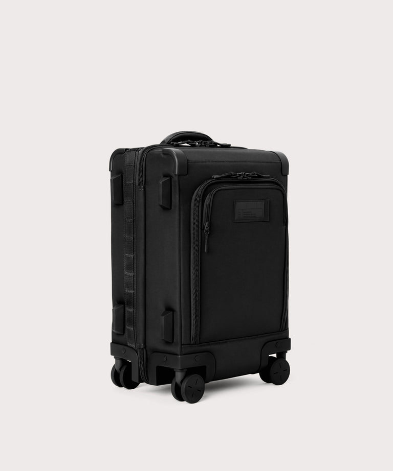 3/4 front view of Seattle carry-on rolling luggage 20.5” in onyx showing side luggage feet
