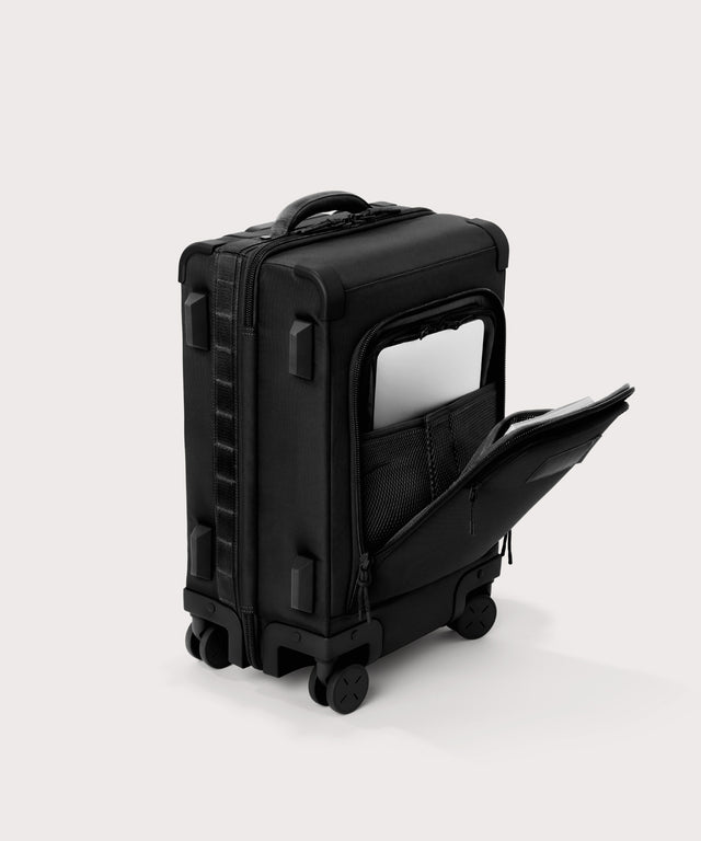 3/4 front view of Seattle carry-on rolling luggage 20.5” in onyx showing side luggage feet
