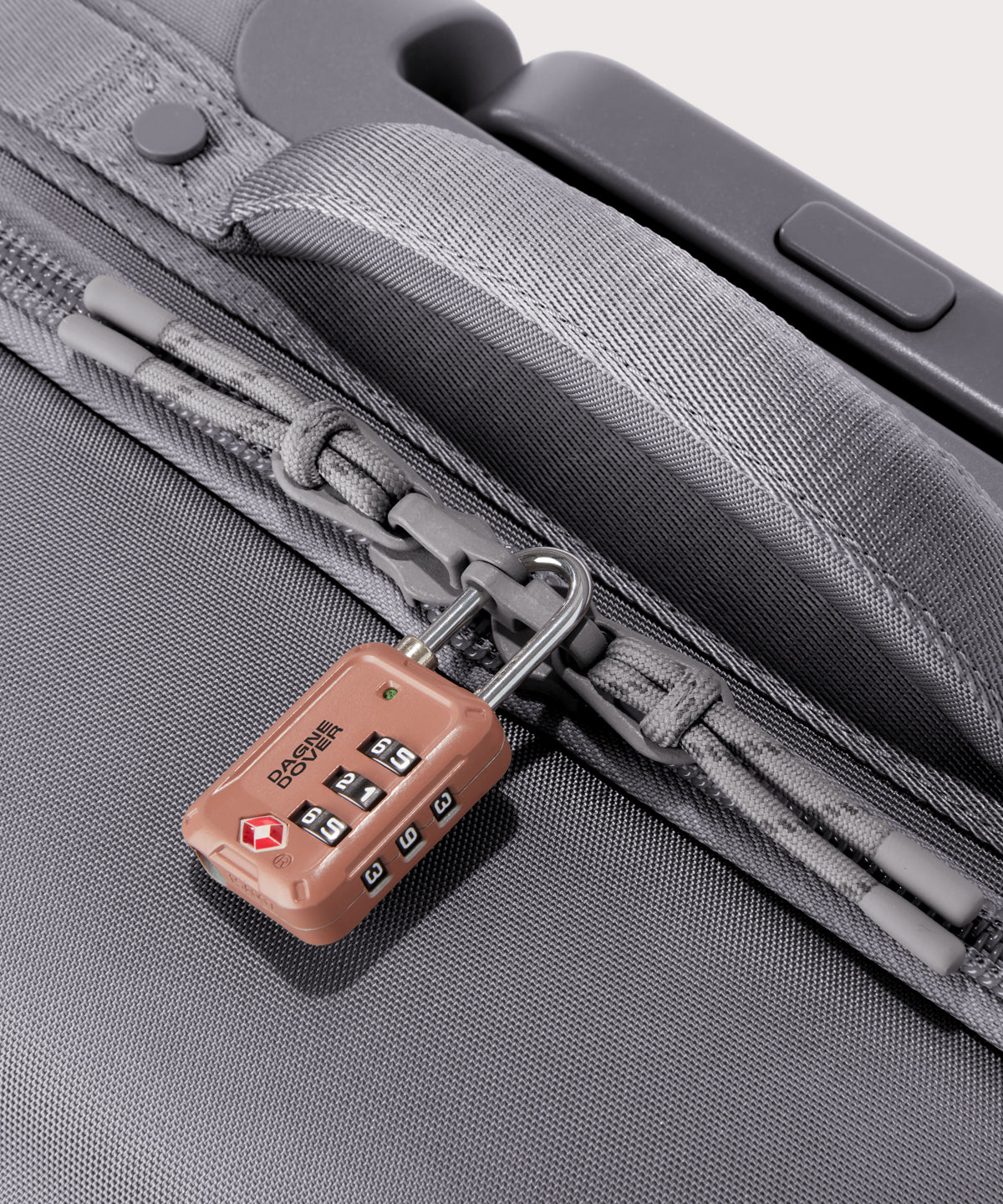 Detail shot of Sydney checked rolling luggage 28.5” in light grey expandable zipper feature

