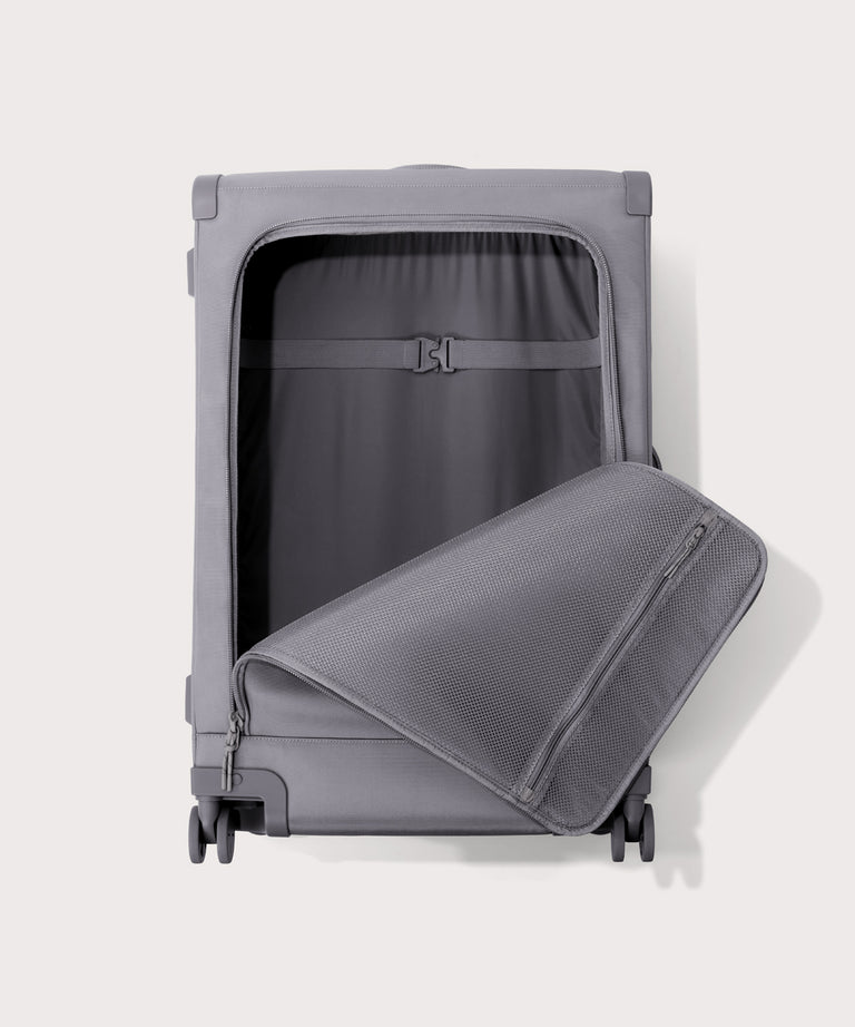 Front view of Sydney checked rolling luggage 28.5” in light grey with front flap opened
