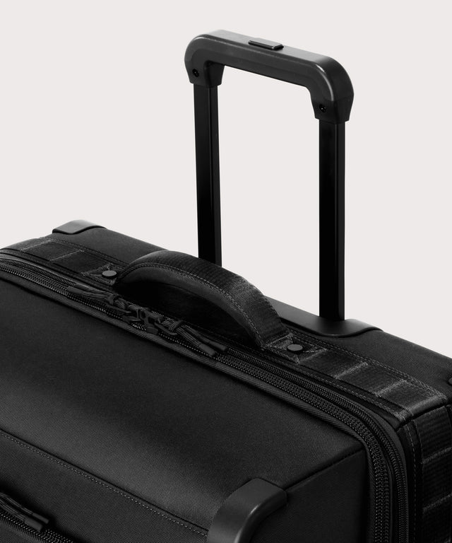 Detail shot of Sydney checked rolling luggage 25