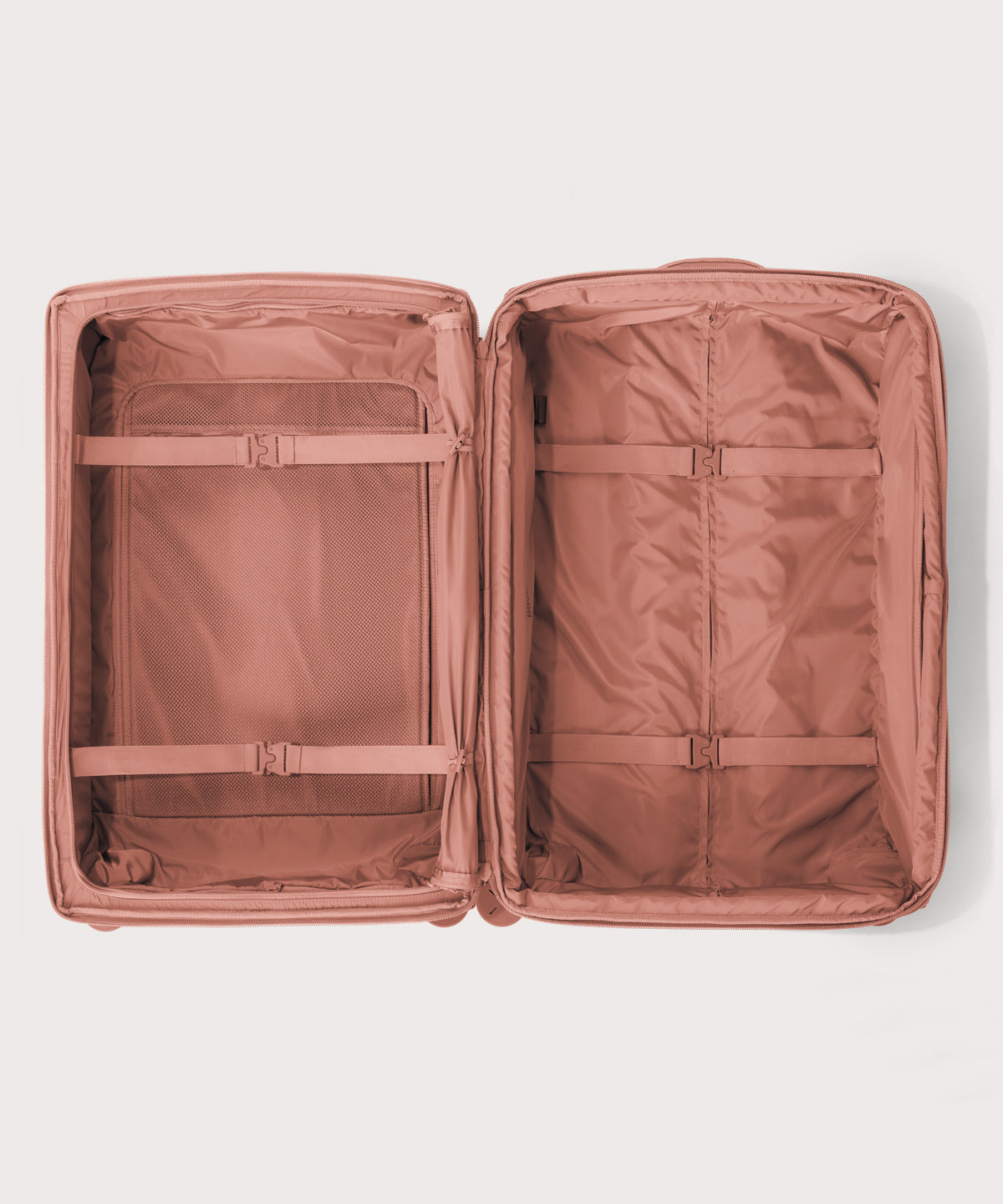 Top down of Sydney checked rolling luggage 28.5” in warm dust pink 
