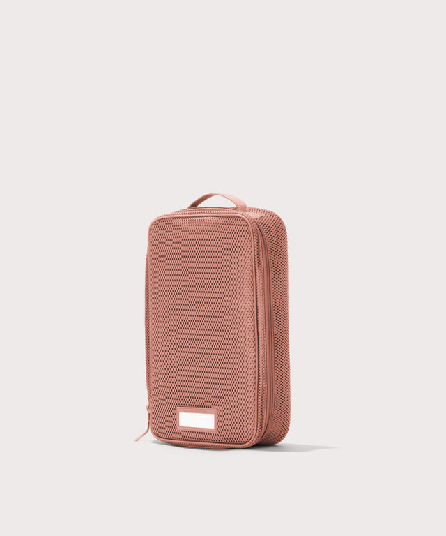 3/4 view of medium Roma packing cube in warm dust pink