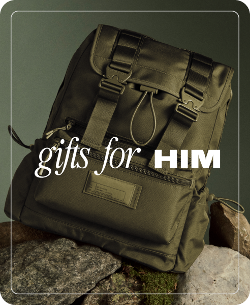 Green backpack on a stone surface with 'gifts for HIM' text overlay.