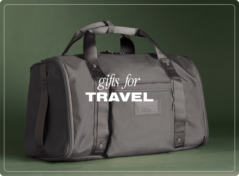 Gray duffel bag with 'gifts for the traveler' text on a green background
